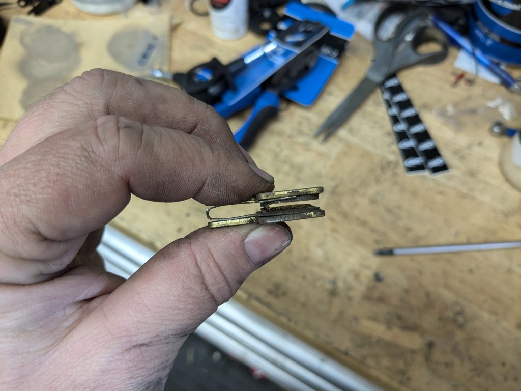 Here you see the top of the pad touching, which prevents the brake from engaging. 